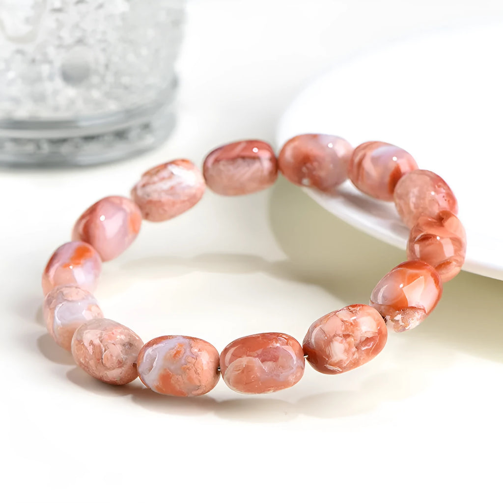 Agate barrel bead bracelet with cherry blossom colour and a ruyi element