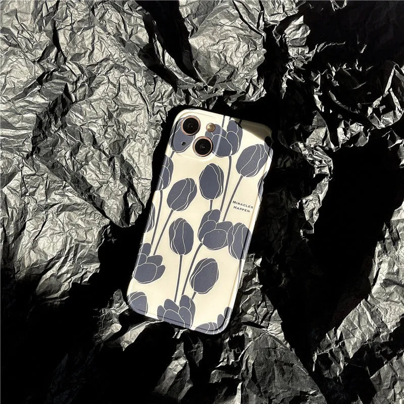 Black silicone iPhone case with intricate cold wind tulip pattern design on back cover