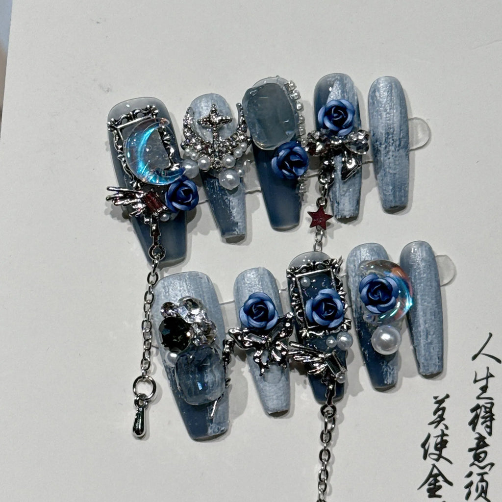 Blue evening manicure set with rose pattern on plastic nail armour suit
