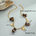 Leopard pendant with heart and flower elements on stainless steel necklace, electroplated 18K finish