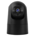 White indoor smart security camera on a table with UK power plug