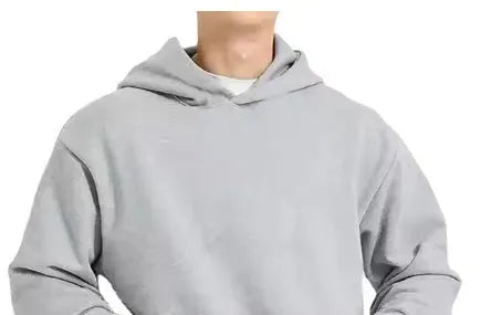 A man wearing a solid colour fleece-lined cotton hoodie with a wool lining.