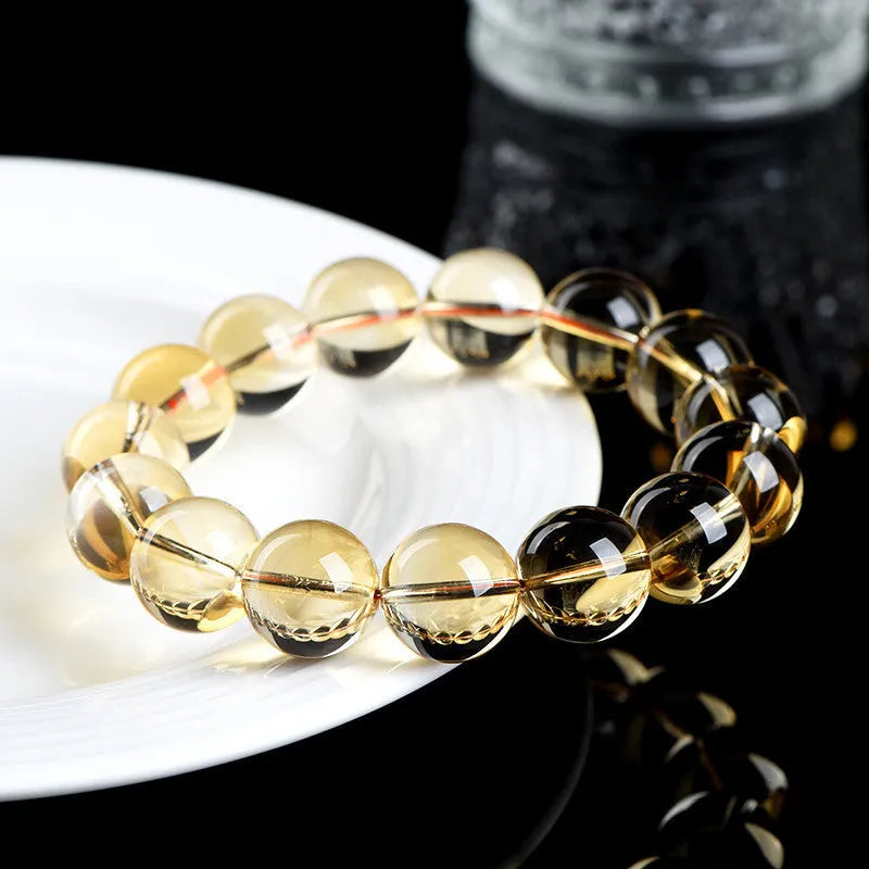 Natural citrine scattered beads bracelet showing polished gemstones in an original design on a wrist.