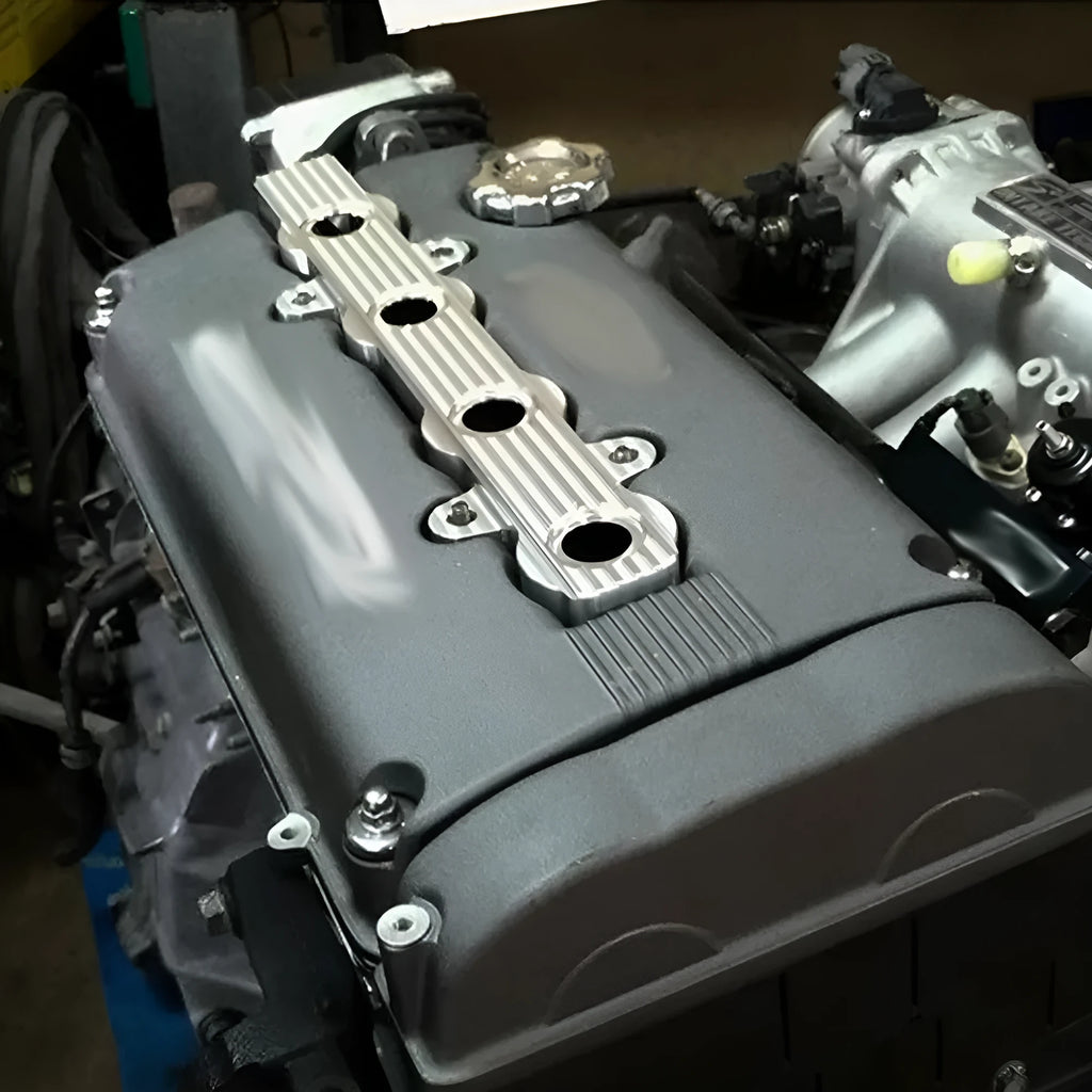 Aluminium alloy engine harness housing cover in blue, red, and silver colours, showing versions with and without holes.