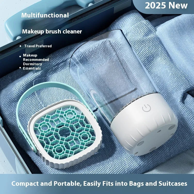 White rechargeable electric makeup brush cleaner with USB cable on a table.