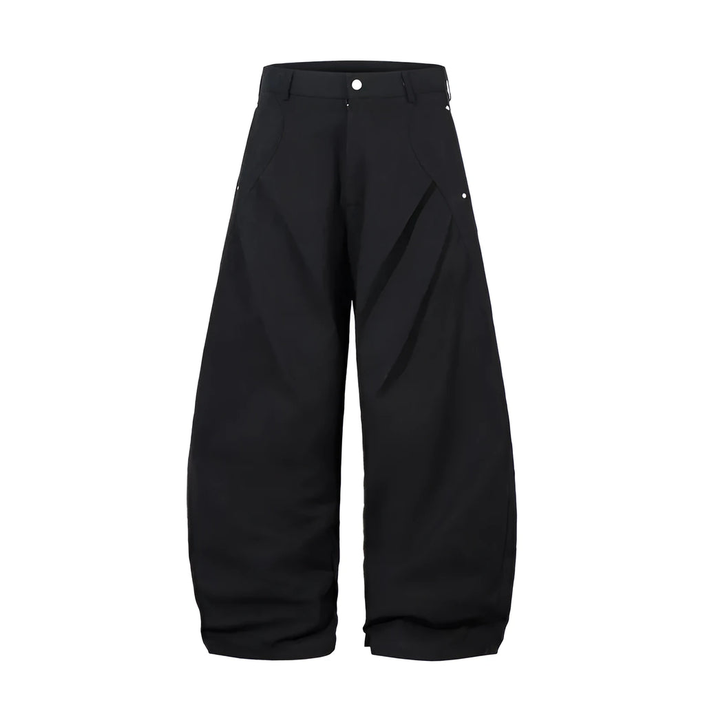 Men's black cotton trousers with pleated machete detailing and loose-fitting wide-leg silhouette