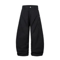 Men's black cotton trousers with pleated machete detailing and loose-fitting wide-leg silhouette
