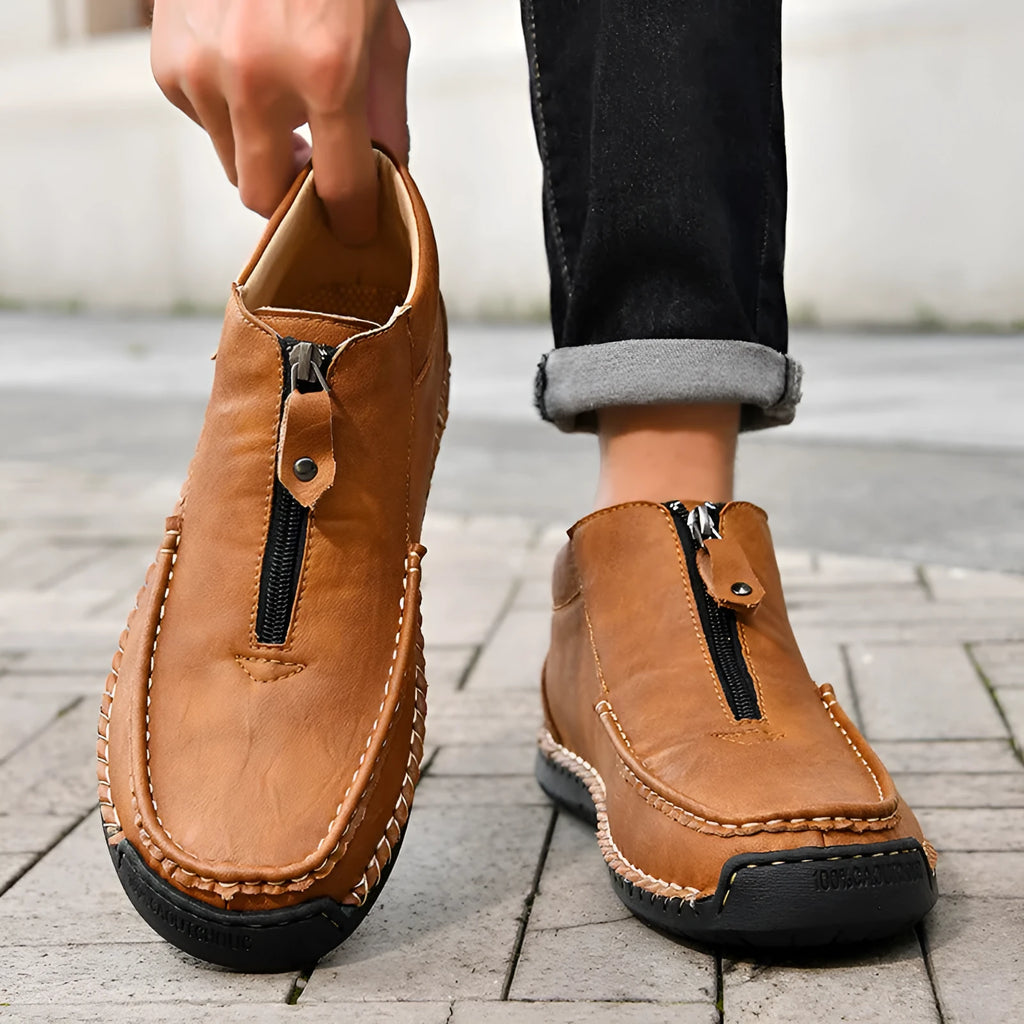 Men's black slip-on leather loafers with round toe and low heel design