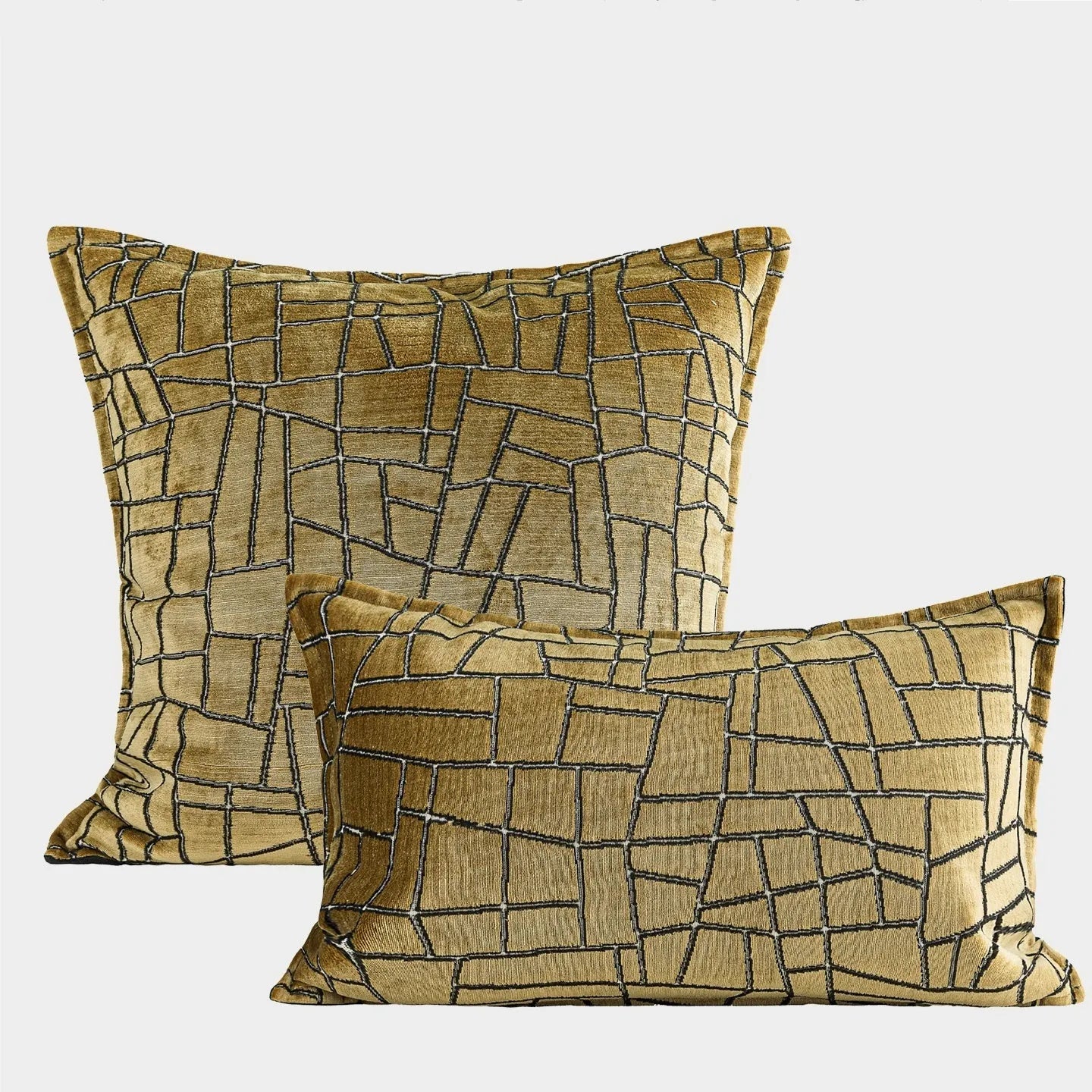 Gold geometric abstract pattern on a square polyester cushion cover and a lumbar pillow.