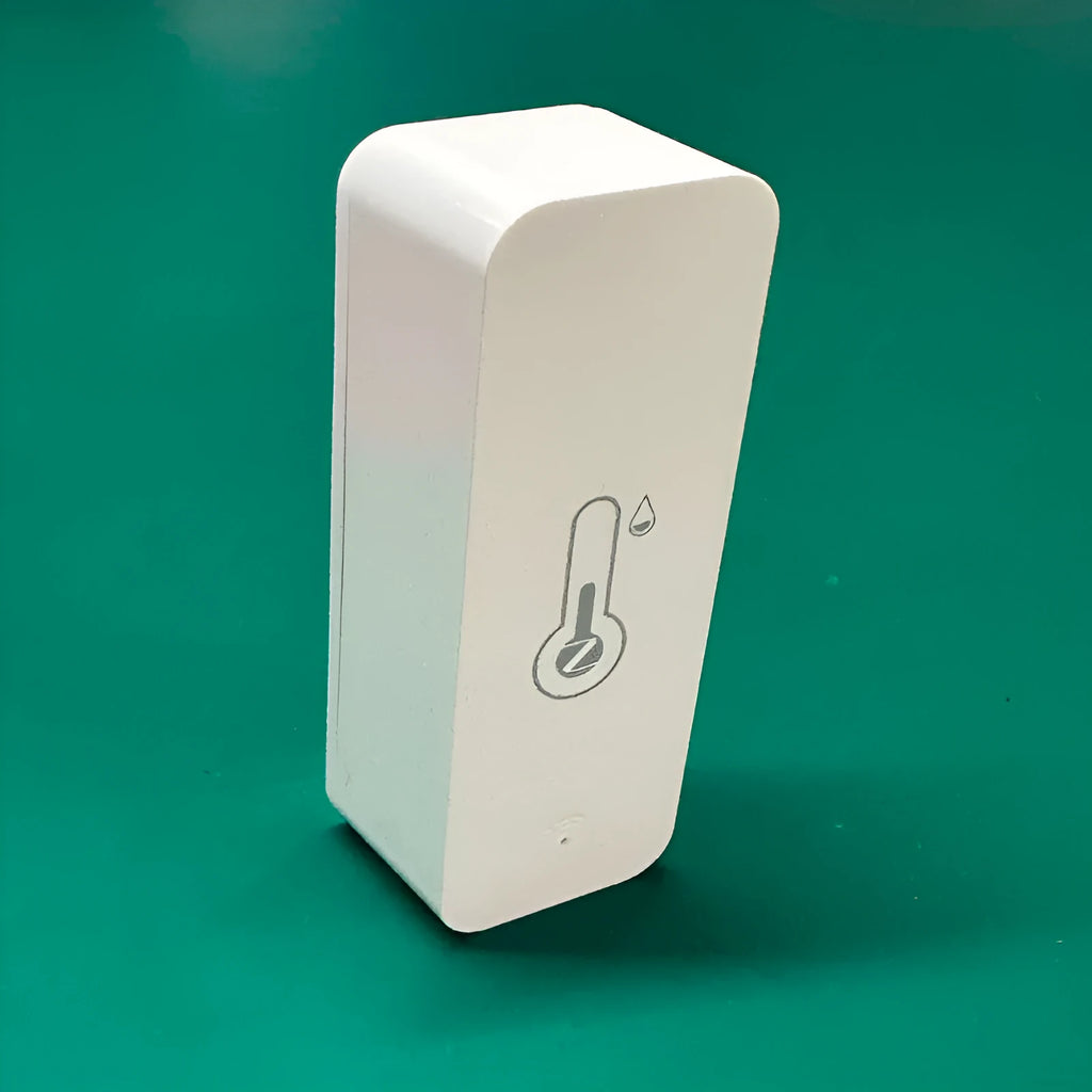 Compact white WiFi temperature and humidity sensor with digital display on ABS plastic case.