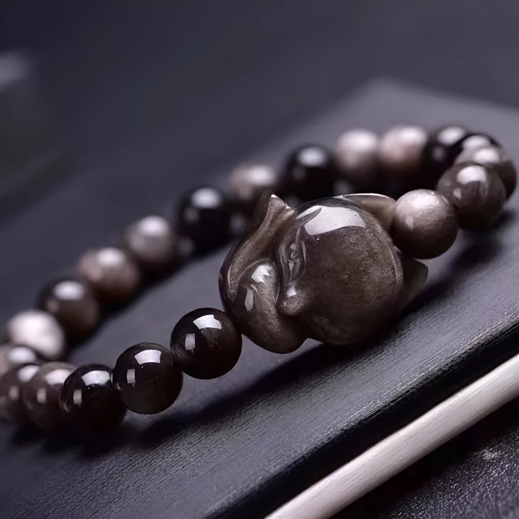 Obsidian fox single ring bracelet with 8mm beads and hand-carved animal motif on elastic cord