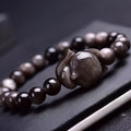 Obsidian fox single ring bracelet with 8mm beads and hand-carved animal motif on elastic cord