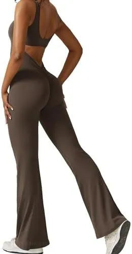 Woman wearing a sleeveless army green flare-leg jumpsuit for yoga or casual wear.