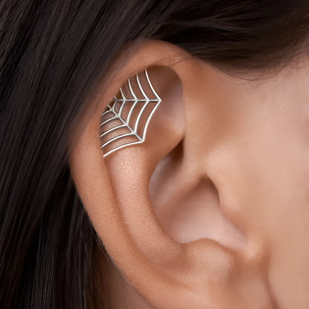 Geometric spider web design metal stud earrings in a gold electroplated finish.
