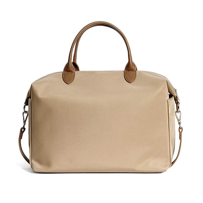 Waterproof nylon shoulder bag with leather accents in black colour showing large capacity interior