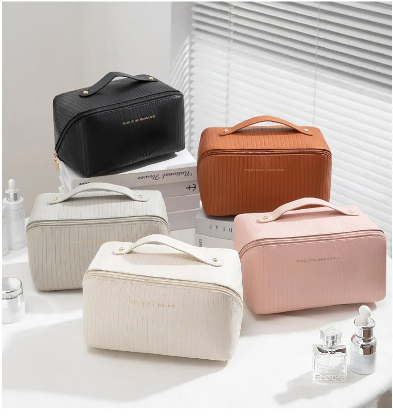 PU leather vertical pattern pillow makeup bag with cubic shape in travel setting