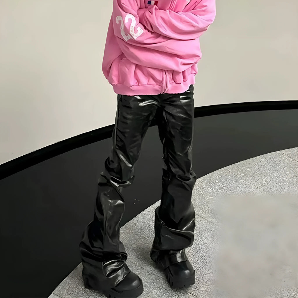 Black women's skinny jeans with a shiny patent leather finish, showing straight-leg cut and mid-rise waist.