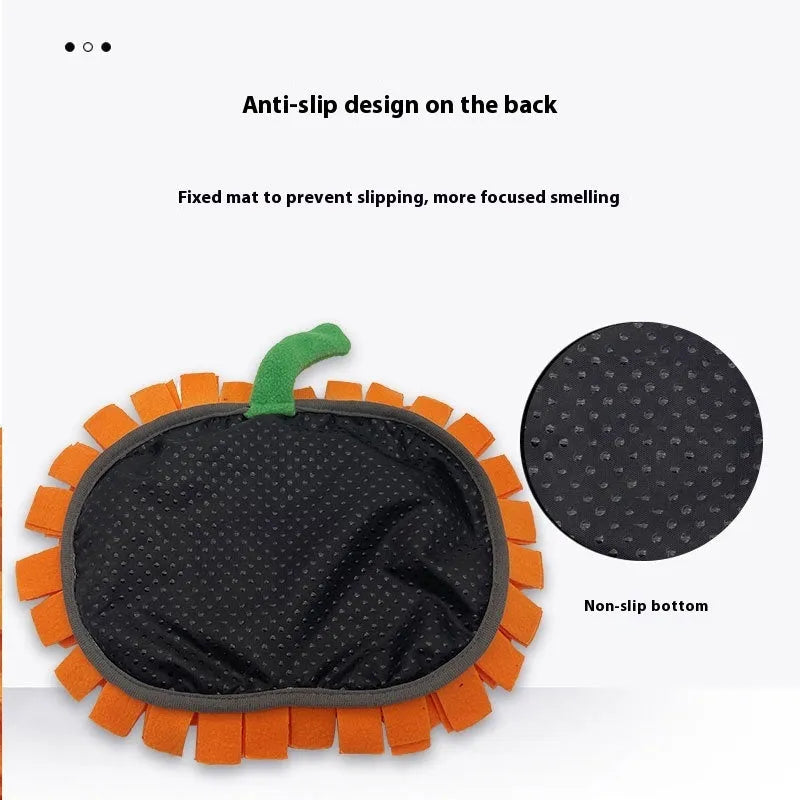 Orange pumpkin-shaped pet smell mat on flat surface showing polar fleece texture
