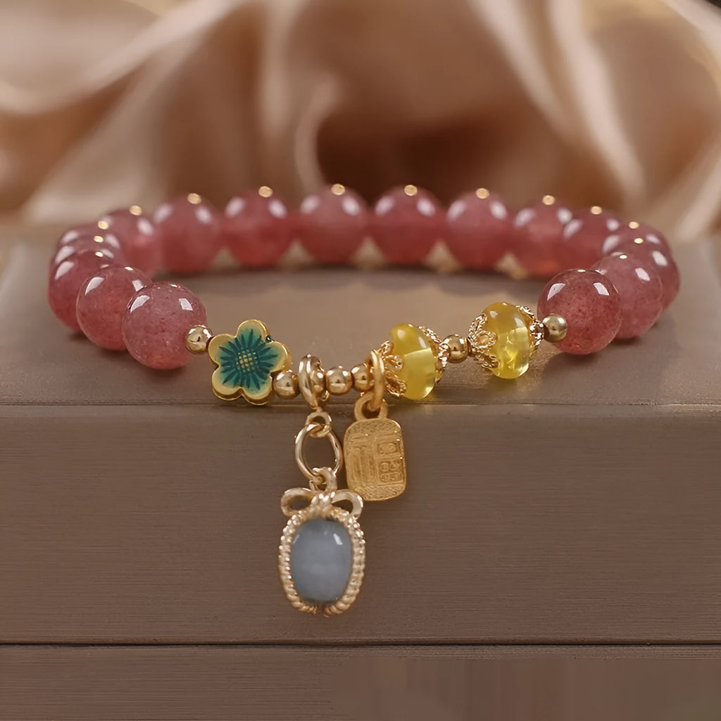 Red strawberry quartz bead bracelet with alloy chain and sparkling rhinestone details.