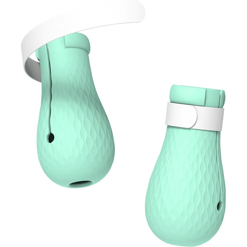 Four green silicone cat scratch prevention foot covers with an adjustable strap laid flat