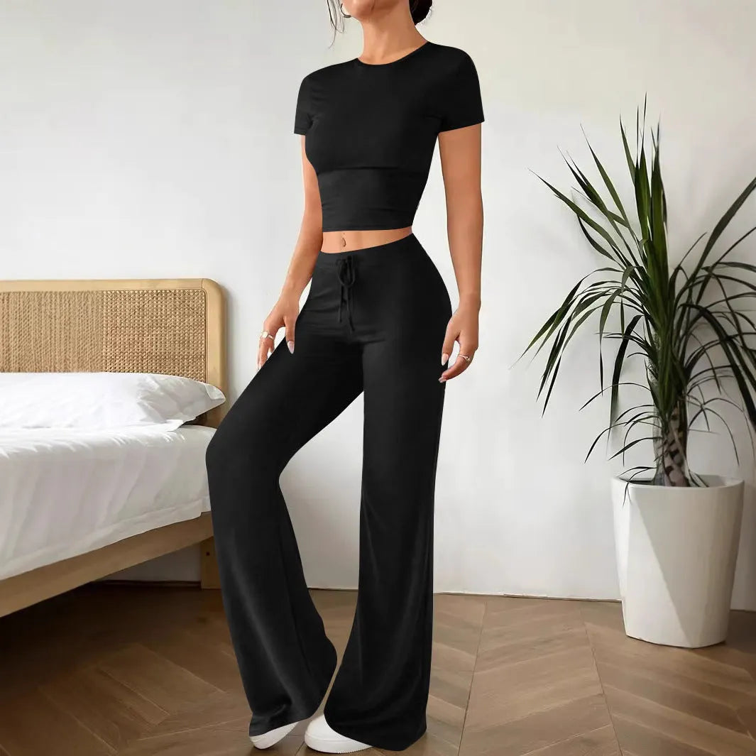 Black polyester trouser suit set with high-waisted trousers and short sleeve V-neck top
