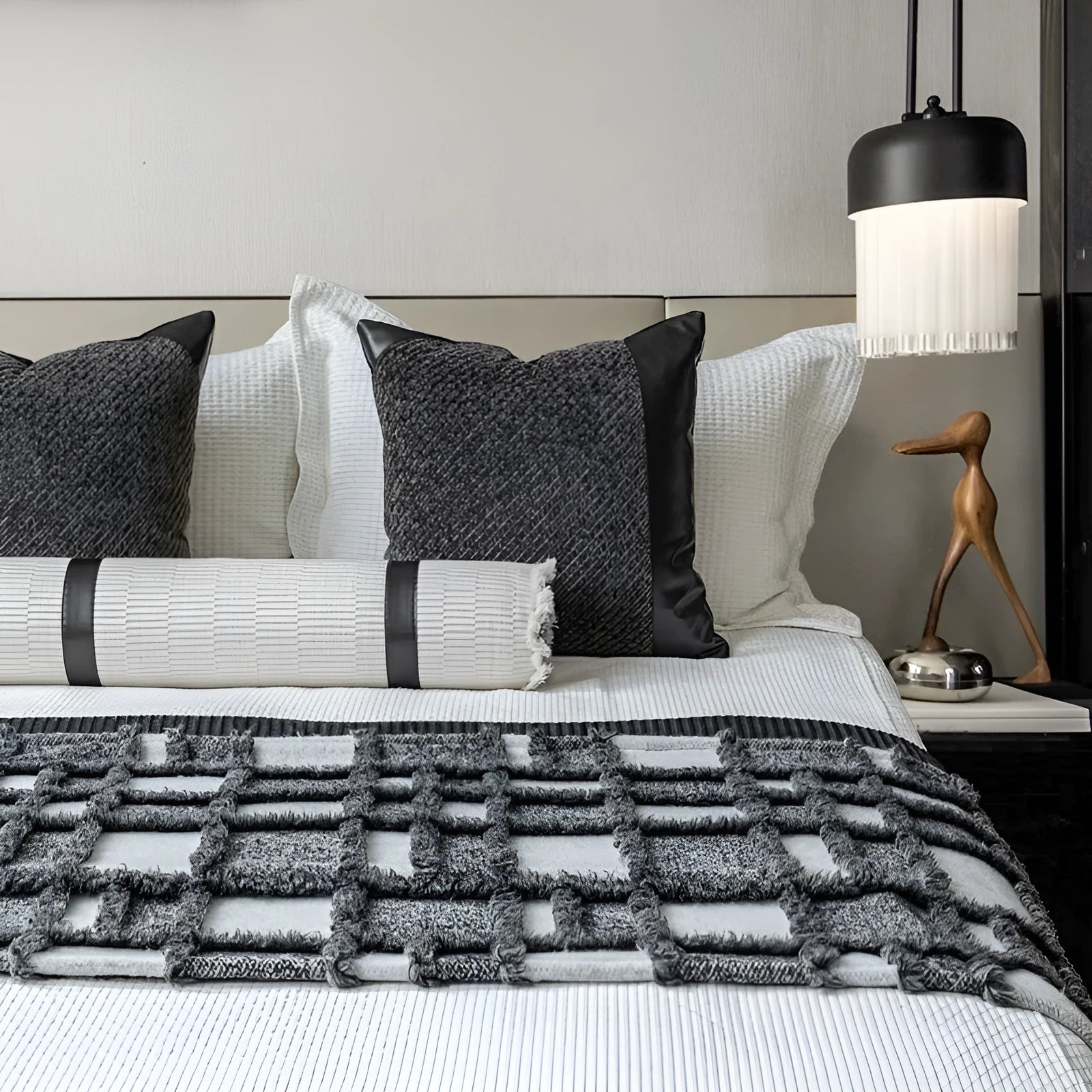 Grey and white plaid bed runner blanket with matching pillow on a 1.5m bed in a minimalist bedroom setting.