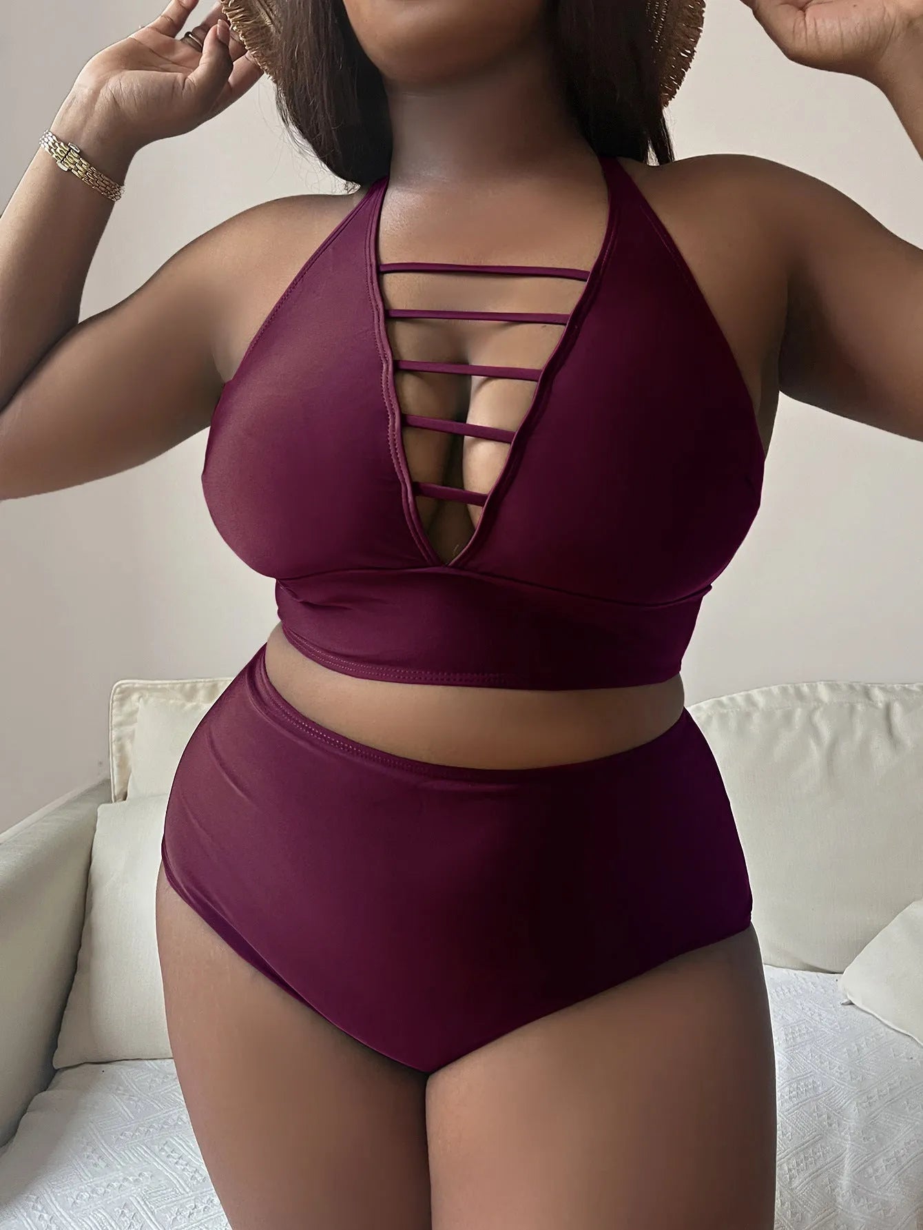 Plus size black halter bikini with adjustable cross straps and high waist briefs on mannequin