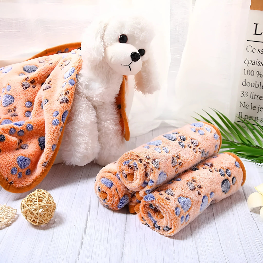 Coral fleece pet blanket with paw print design in beige colour laid flat showing size