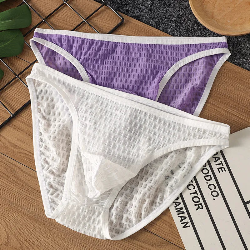 Men's low waist transparent lace underwear in multiple colours on a white background.
