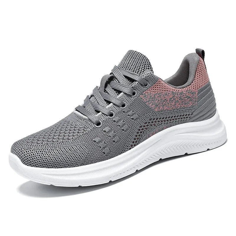 Women's low-top black mesh sneakers with round toe and white PVC sole, featuring front lace-up design.