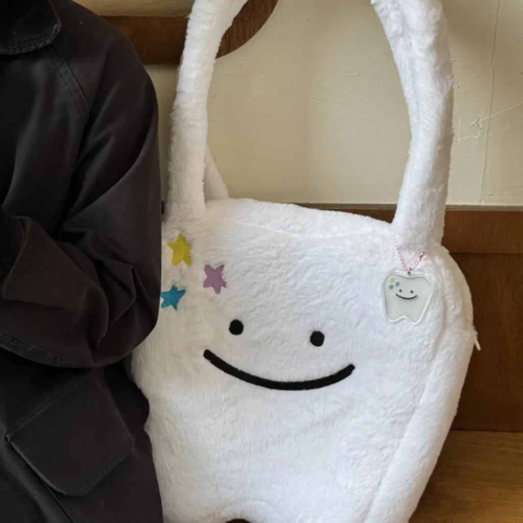 White plush shoulder tote bag with cute teeth design and crossbody strap