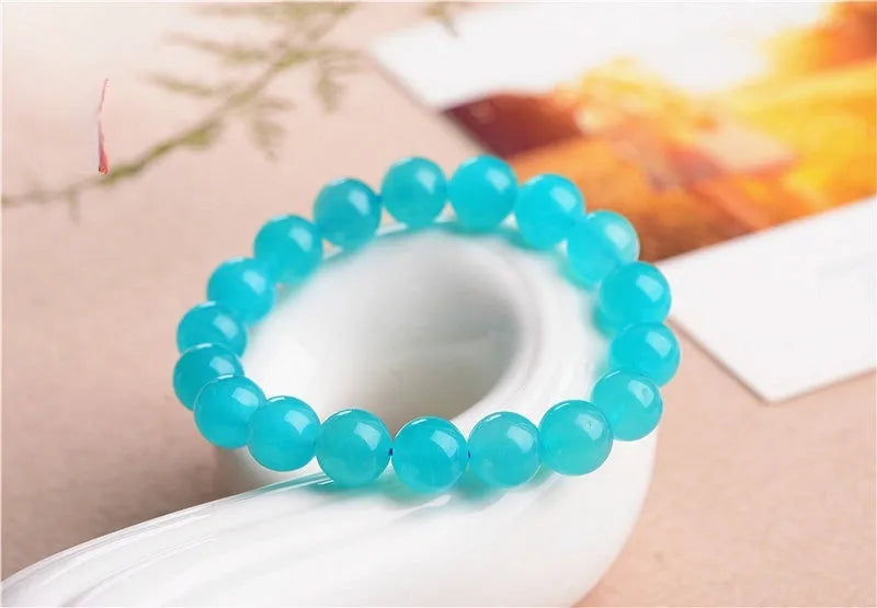 Grade 7A Amazonite natural stone bracelet with polished ice-colour beads on a black elastic cord.