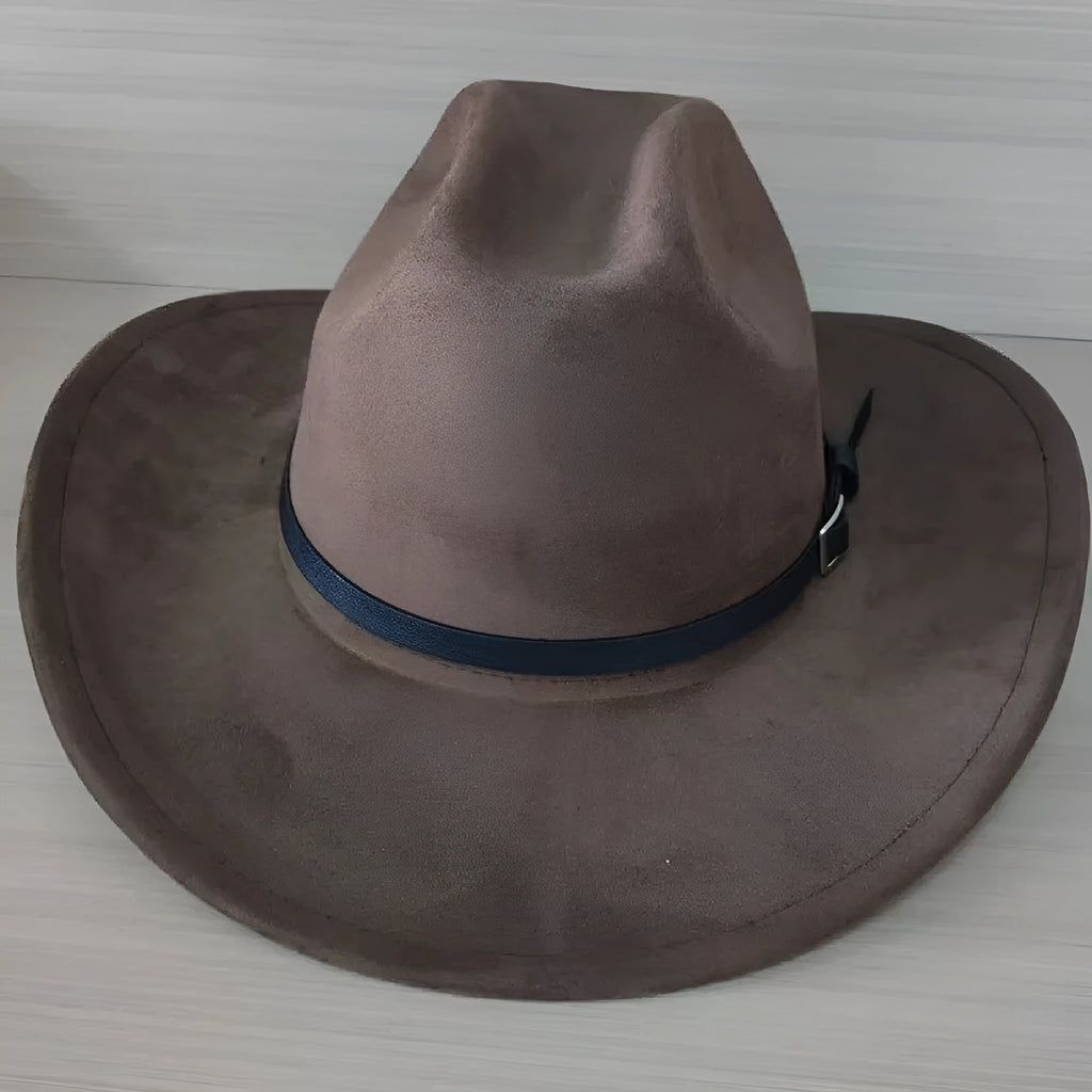 Brown leather velvet Western cowboy hat with curved brim and conical crown on a neutral background.