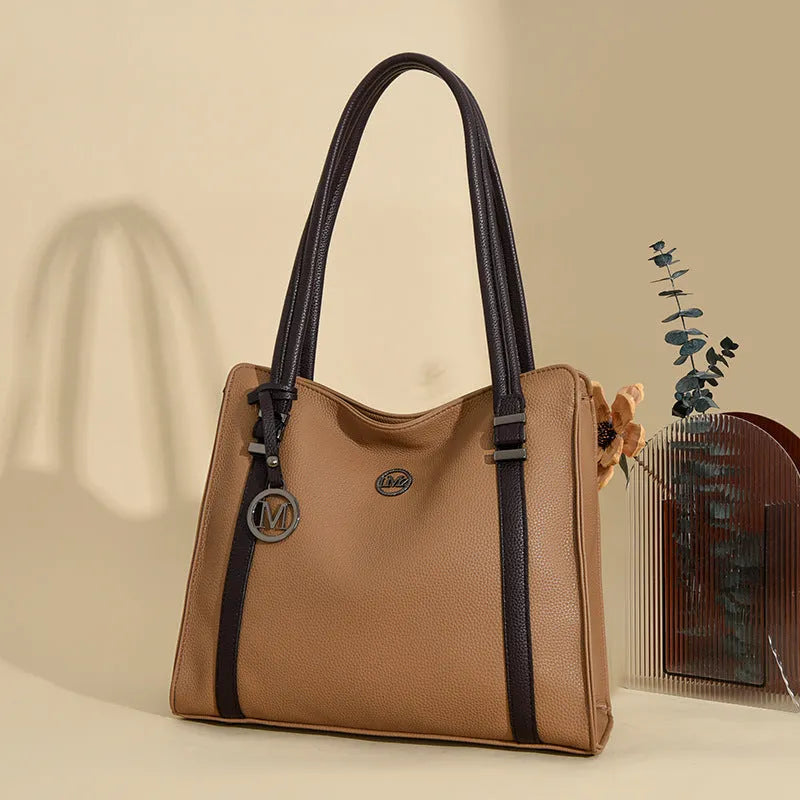 Genuine leather women's crossbody bag in retro style showing horizontal square shape and double shoulder straps.
