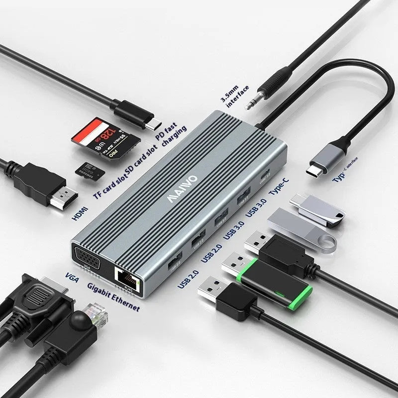 Aluminium Steam Deck six-in-one docking station with HDMI, USB, and Ethernet ports next to a handheld console.