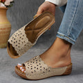 Women's wedge beach slippers with flower cutout design on PVC upper and fish-mouth toe shape.