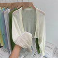 Women's linen blend blouse with hollow-out design and long lantern sleeves in apricot colour