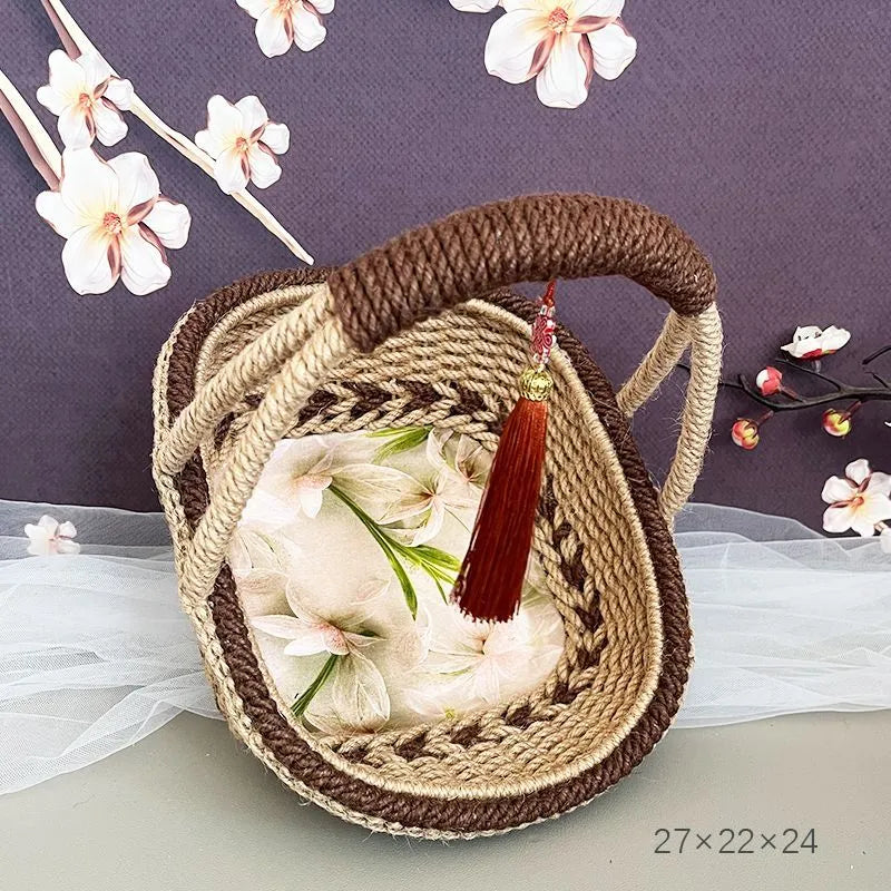 Coffee brown hand-woven straw basket with hemp rope detailing.