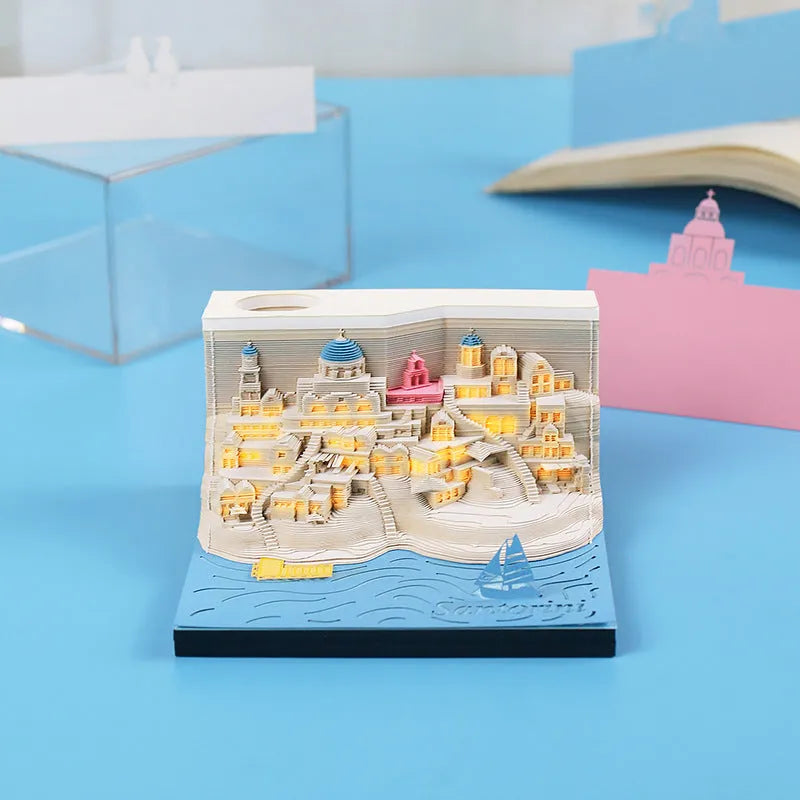 Romantic Santorini 3D notepad paper carving building model with lighting on desk