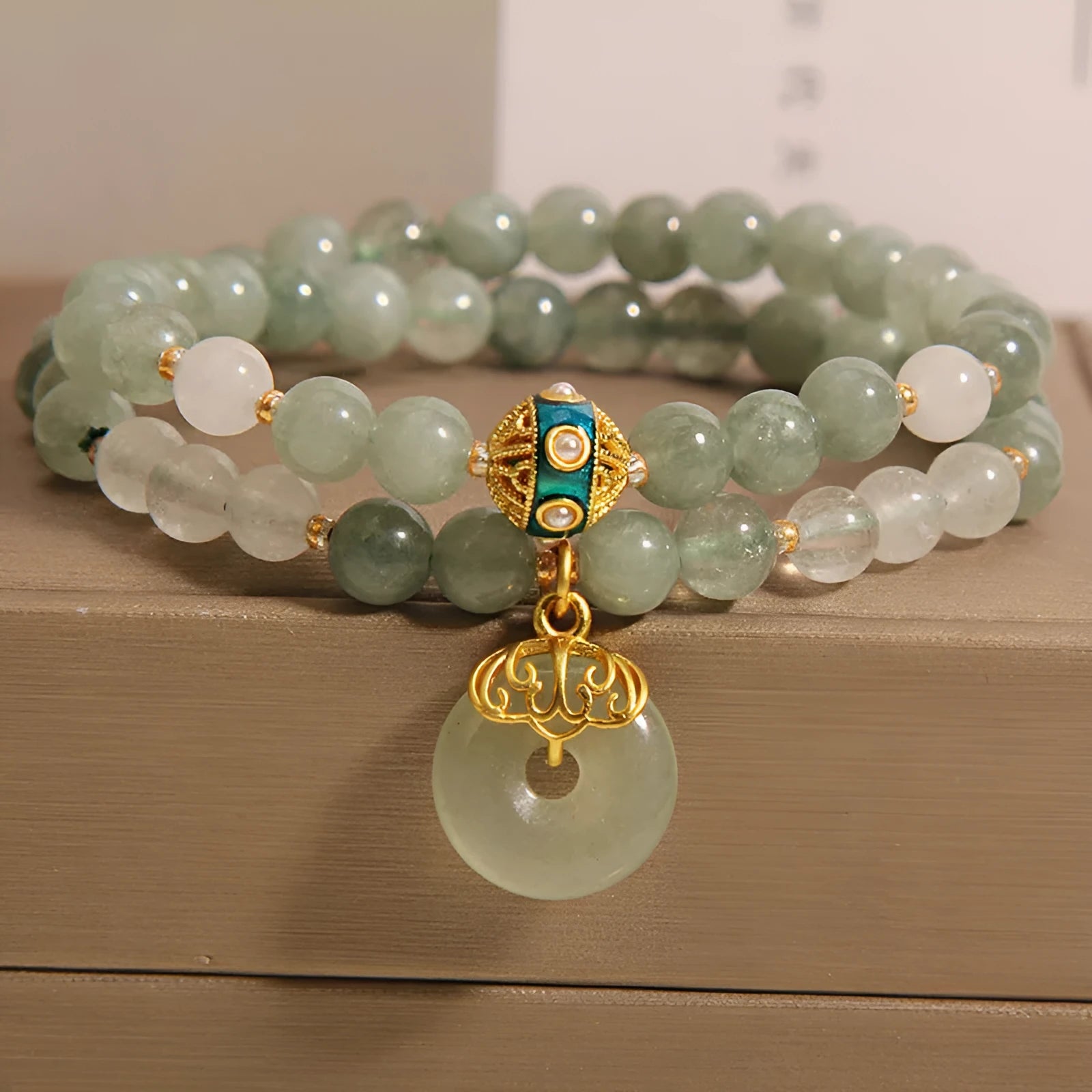 Aventurine double-layer jade bracelet with rhinestone accents and peace buckle closure in emerald green
