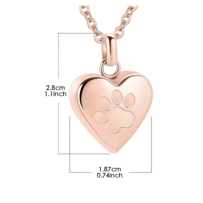Silver heart-shaped titanium steel necklace with paw print detail and openable compartment.