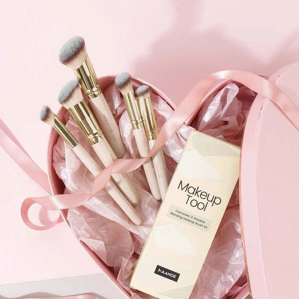 Apricot coloured 5-piece angled makeup brush set with synthetic bristles for powder and blush application