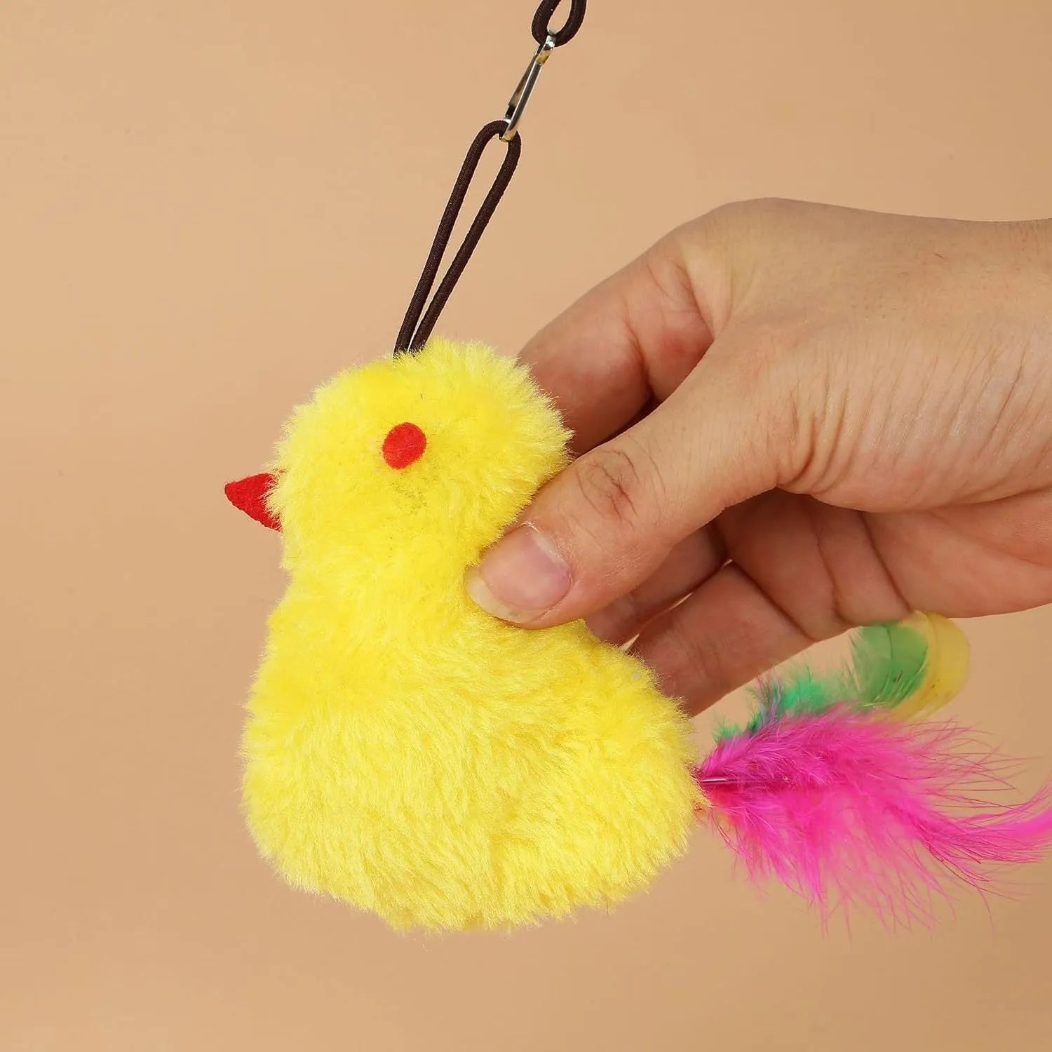 Grey and yellow interactive cat toy with retractable elastic rope, dangling mouse toy, and treat dispenser bulb