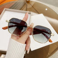Women's frameless fashion glasses with wood grain alloy frame and coloured lenses.