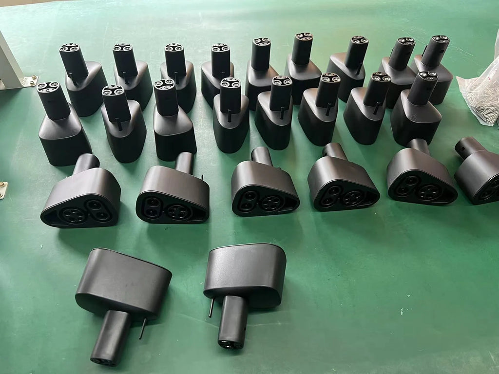 Black Tesla charging plug conversion adaptor with dustproof design and copper-silver pins