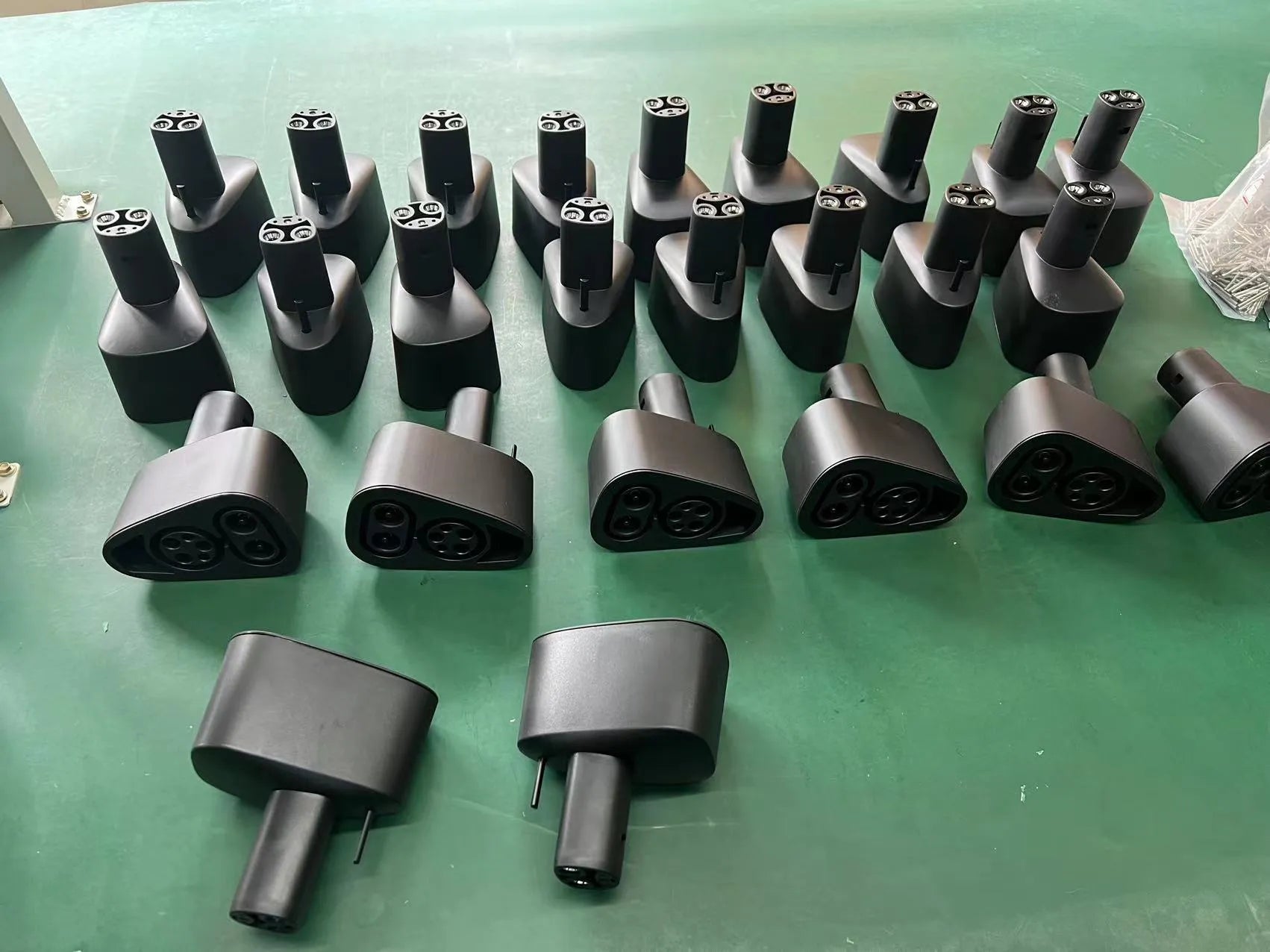 Black Tesla charging plug conversion adaptor with dustproof design and copper-silver pins
