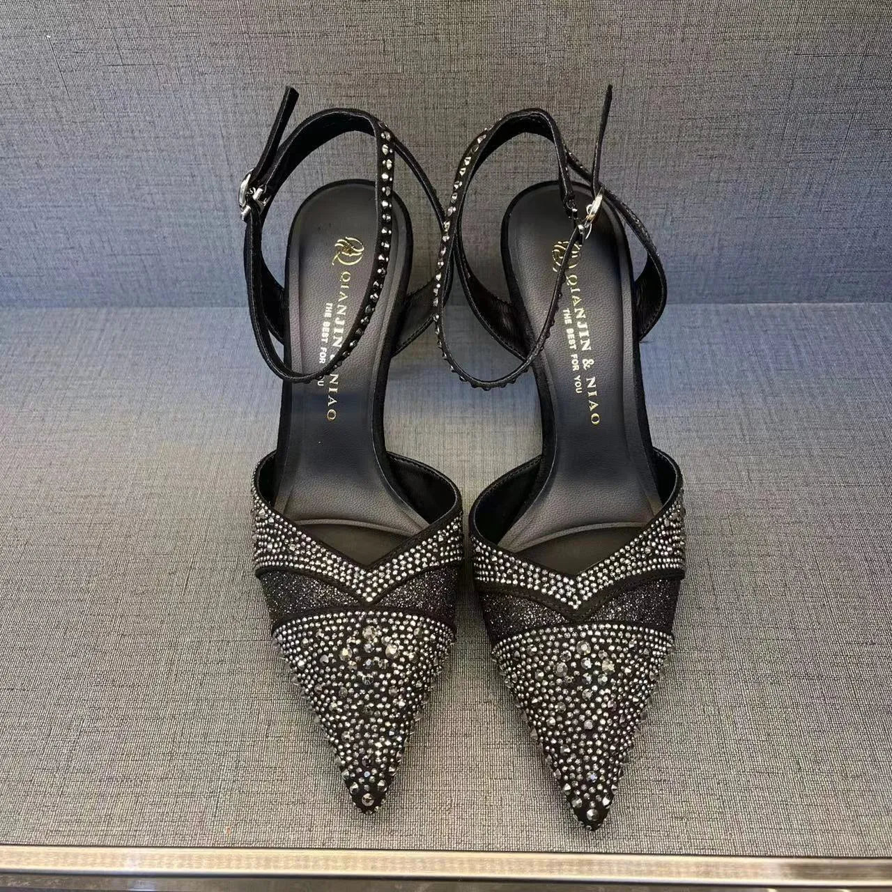 Women's hollow high heels with red sole and stiletto heel in black or silver colours