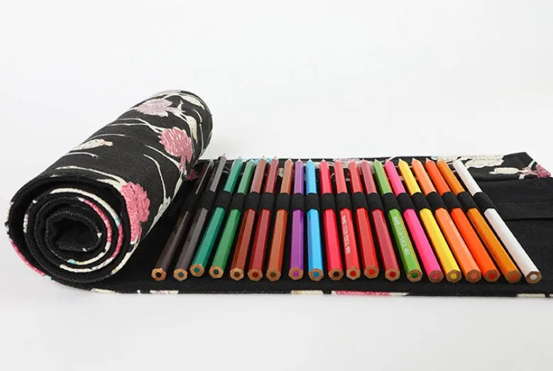 Square canvas rolling pencil case with ballet girl print, unrolled to show multiple pencil holes.
