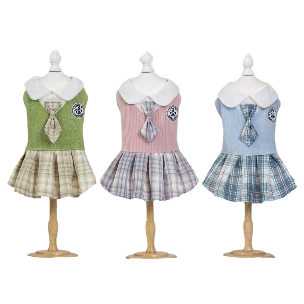 Pet dog wearing blue tartan skirt with princess style design