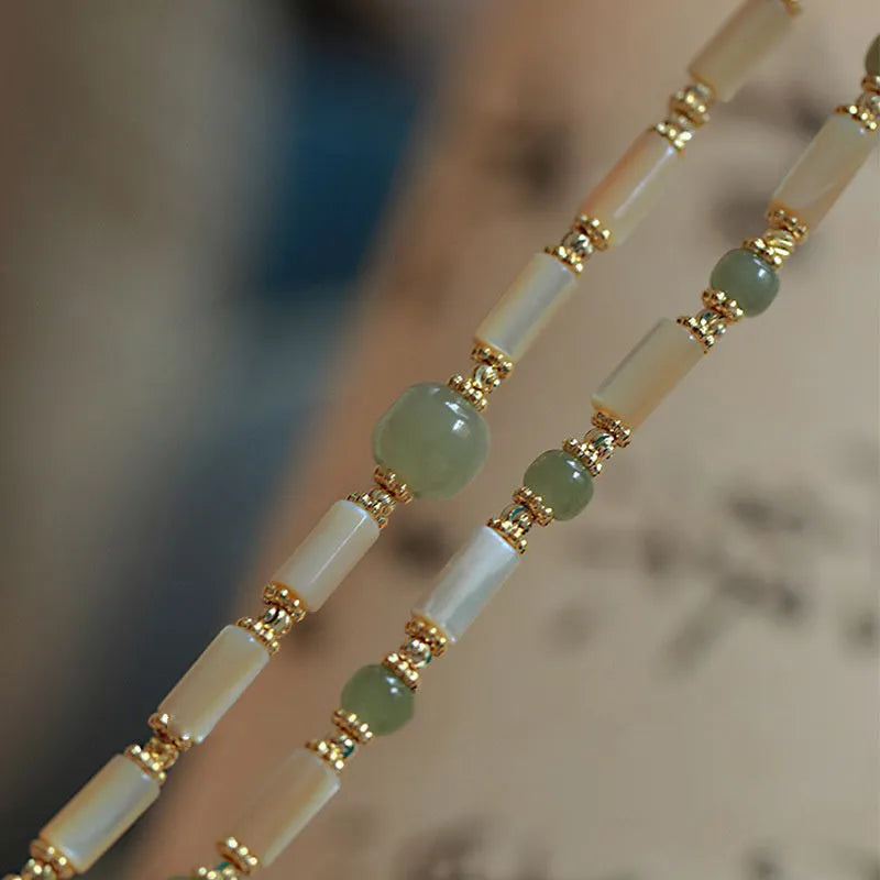 Handmade Hetian Jade white lip shell bracelet with round beads in simple geometric design